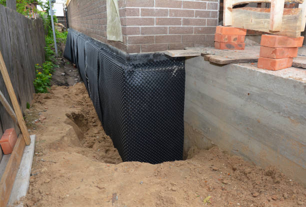 Happy homeowners after waterproofing job in Pontiac
